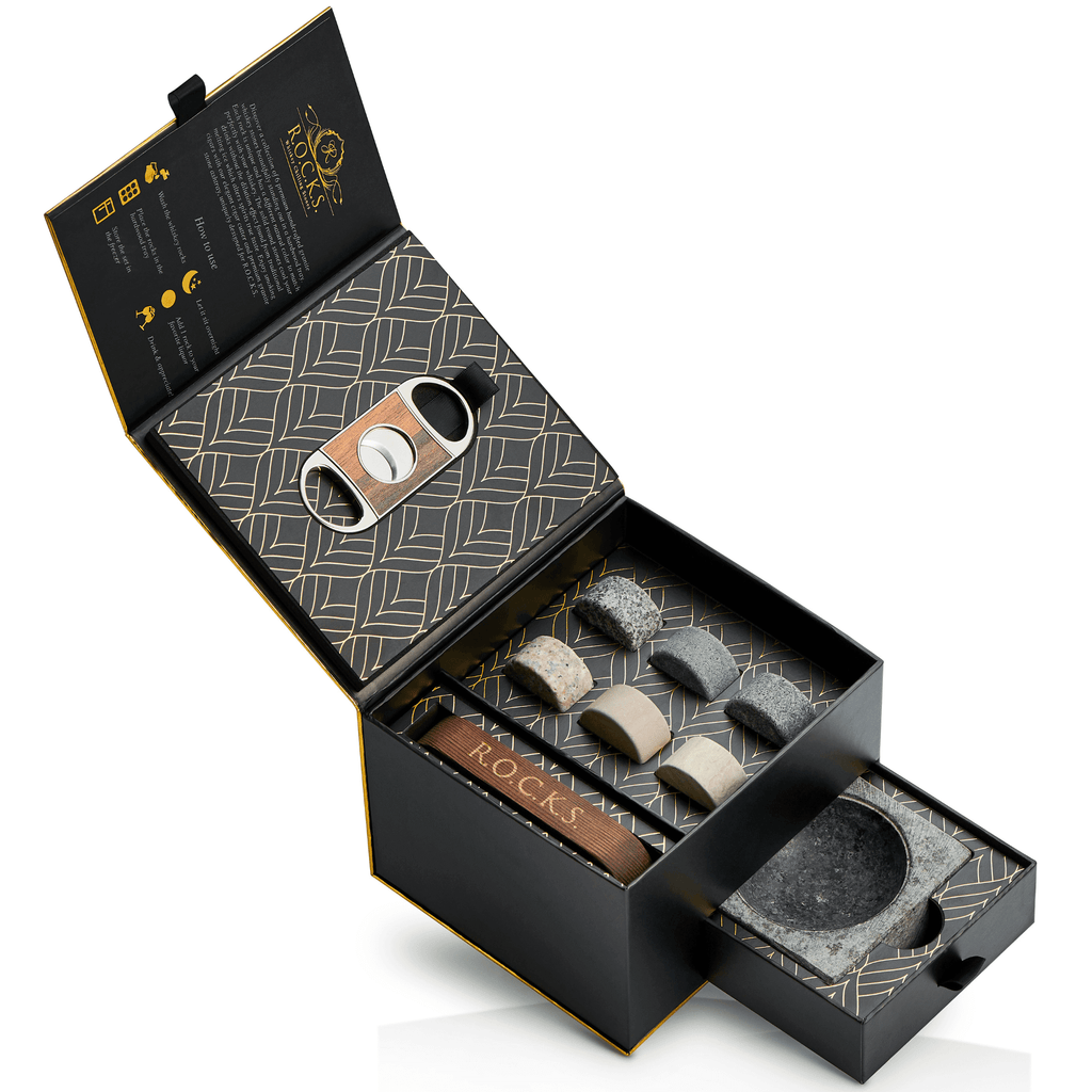 Cigar accessories set including stones, cutter, and humidor in a decorative box. Gift for Dad