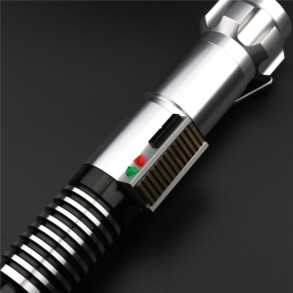 Close-up of a lightsaber handle with metallic and black design on a dark background. Gifts for Dad.