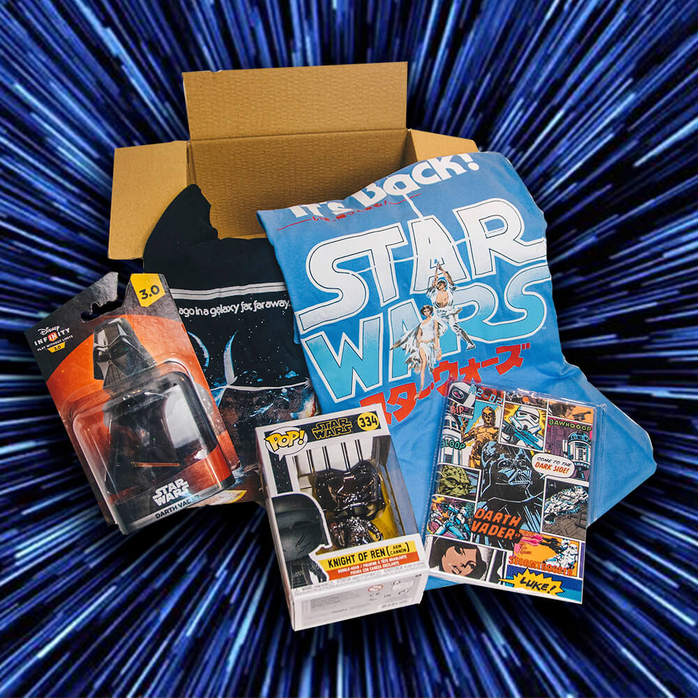 Collection of Star Wars merchandise including a box, action figure, and pop vinyl on a blue starry background. Gifts for Dad.