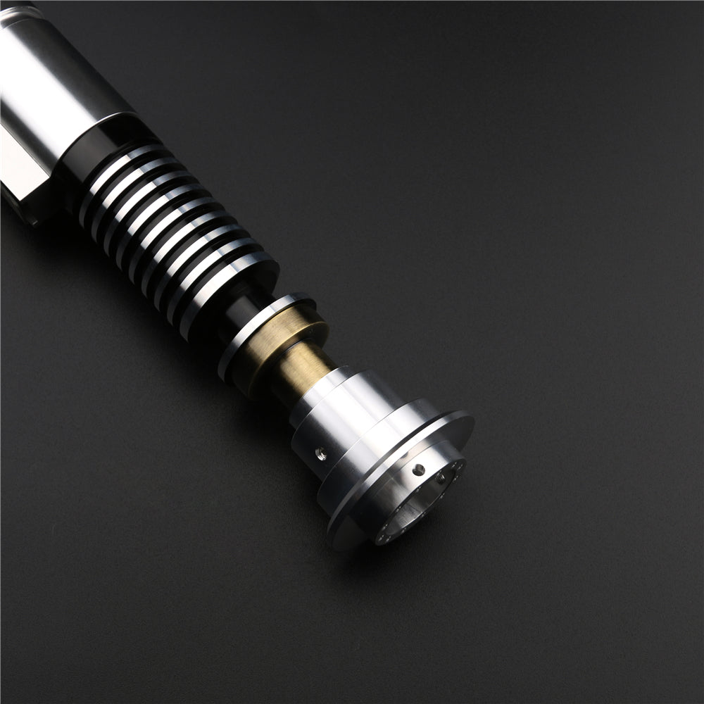 Metallic cylindrical object with reflective surfaces on a dark. Gift for Dad. background